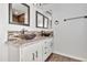 Bathroom featuring double vessel sinks, a mosaic tile backsplash, and granite countertops at 4669 E Olney Ave, Gilbert, AZ 85234