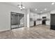 Modern kitchen featuring white cabinets, stainless steel appliances, and a sliding door to patio at 4669 E Olney Ave, Gilbert, AZ 85234