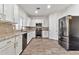 Updated kitchen with stainless steel appliances, granite counters, and a decorative backsplash at 4669 E Olney Ave, Gilbert, AZ 85234