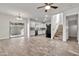 Bright living room featuring tile floors, a ceiling fan, and abundant natural light at 4669 E Olney Ave, Gilbert, AZ 85234