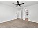 Spacious carpeted bedroom with a ceiling fan and an ensuite bathroom at 4669 E Olney Ave, Gilbert, AZ 85234