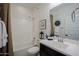 Clean bathroom with a combined shower and tub, modern vanity, and neutral-toned decor at 5844 S Tobin --, Mesa, AZ 85212