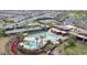 Aerial view of community pools with tennis courts, clubhouse, and well-maintained landscaping at 5844 S Tobin --, Mesa, AZ 85212