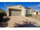 Single-story home with a brick-paved driveway, two-car garage, and well-maintained desert landscaping at 5844 S Tobin --, Mesa, AZ 85212