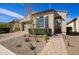 Charming single-story home with desert landscaping, a paved walkway, and a neutral-toned stucco exterior at 5844 S Tobin --, Mesa, AZ 85212