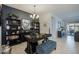 Stylish home office featuring dark wood desk, built-in bookshelves, and elegant decor at 5844 S Tobin --, Mesa, AZ 85212