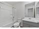 A full bathroom has a shower-tub combination, toilet, and modern vanity at 618 E Elm Ln, Avondale, AZ 85323