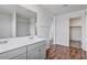 Open bathroom view showcasing double sinks, mirrors, and modern fixtures at 618 E Elm Ln, Avondale, AZ 85323