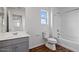 Bathroom featuring shower-tub combination, vanity, and wood-look floors at 618 E Elm Ln, Avondale, AZ 85323