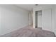 Bedroom featuring neutral carpet, closet, and white walls at 618 E Elm Ln, Avondale, AZ 85323