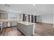 Modern kitchen featuring stainless steel appliances, granite countertops, and an island with seating at 618 E Elm Ln, Avondale, AZ 85323