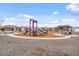 Community playground featuring two slides and a covered picnic table at 618 E Elm Ln, Avondale, AZ 85323