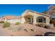 Charming single-story home with desert landscaping, three car garage, and a welcoming front porch entry at 630 W Madero Ave, Mesa, AZ 85210