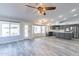 Open kitchen with gray cabinetry, stainless steel appliances, and wood-look floors at 630 W Madero Ave, Mesa, AZ 85210