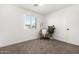 Bright bedroom featuring neutral carpet, a large window and fresh white walls at 645 N 97Th St, Mesa, AZ 85207