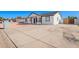 Angle view showing the modern color scheme and spacious driveway of this recently renovated home at 645 N 97Th St, Mesa, AZ 85207