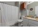 Bathroom featuring tile flooring, a shower with a curtain, and a stylish vanity at 6834 S Dennis Dr, Tempe, AZ 85283