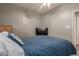 A cozy bedroom featuring a comfortable bed and a television for relaxation at 6834 S Dennis Dr, Tempe, AZ 85283