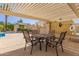 Poolside lounge area with tables, chairs, and a view of the swimming pool, perfect for relaxation at 6834 S Dennis Dr, Tempe, AZ 85283