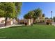 Well-maintained community space with lush greenery and a gated entrance at 6834 S Dennis Dr, Tempe, AZ 85283