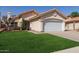 Lovely home featuring a lush green lawn and a pristine white garage door at 6834 S Dennis Dr, Tempe, AZ 85283