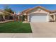 Charming single-story home with a well-manicured lawn and a two-car garage at 6834 S Dennis Dr, Tempe, AZ 85283