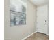 Inviting entryway with tile flooring, a window for natural light, and a white door at 7355 W Red Hawk Dr, Peoria, AZ 85383