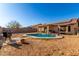 Spacious backyard with a pool, solar panels, and ample space for outdoor enjoyment at 8029 W Whyman Ave, Phoenix, AZ 85043