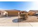 Charming single-story home featuring a two-car garage, desert landscaping, and a terracotta tile roof at 8029 W Whyman Ave, Phoenix, AZ 85043