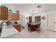 Kitchen area features a breakfast table, and modern appliances at 8029 W Whyman Ave, Phoenix, AZ 85043