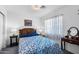 Cozy bedroom featuring a floral bedding, stylish furniture, and abundant natural light at 827 W Kesler Ln, Chandler, AZ 85225