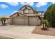 Charming two-story home with a tile roof, three-car garage, and mature landscaping at 827 W Kesler Ln, Chandler, AZ 85225