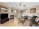 Open concept living room with fireplace and wood look tile flooring at 827 W Kesler Ln, Chandler, AZ 85225