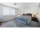 Cozy main bedroom featuring neutral walls, carpet, and a queen-size bed at 827 W Kesler Ln, Chandler, AZ 85225