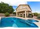 Spacious pool and backyard with lush greenery, covered patio and spa at 827 W Kesler Ln, Chandler, AZ 85225