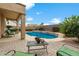 Backyard pool area with desert landscaping, brick patio and view of neighborhood homes at 827 W Kesler Ln, Chandler, AZ 85225