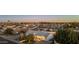 An aerial view of a home with a manicured front yard and surrounding neighborhood at sunset at 8443 E Sheridan St, Scottsdale, AZ 85257