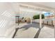 Covered patio and backyard area with a white pergola, desert landscaping, and ample space at 8443 E Sheridan St, Scottsdale, AZ 85257