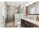 Nicely tiled bathroom with a glass-enclosed shower and modern fixtures at 8443 E Sheridan St, Scottsdale, AZ 85257