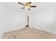 Minimal carpeted bedroom with a ceiling fan and natural lighting at 8443 E Sheridan St, Scottsdale, AZ 85257