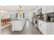 Modern kitchen with stainless appliances, an island, and a view that flows to the Gathering room at 8443 E Sheridan St, Scottsdale, AZ 85257