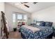 Bedroom featuring a work desk with a bay window, carpet floors, and a floral quilt at 8500 E Southern Ave # 551, Mesa, AZ 85209