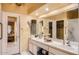 Bright bathroom features a double vanity, mirrored wall, and separate shower at 9130 E Crystal Dr, Sun Lakes, AZ 85248