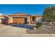 Charming single-story home features a well-kept yard, desert landscaping, and a warm, inviting facade at 9130 E Crystal Dr, Sun Lakes, AZ 85248