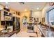 View of the kitchen showcasing stainless steel appliances, tile flooring, and custom cabinetry at 9130 E Crystal Dr, Sun Lakes, AZ 85248