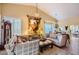 Bright living room featuring comfortable seating, decorative wall art, and lots of natural light at 9130 E Crystal Dr, Sun Lakes, AZ 85248