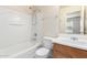 Bathroom features white tub, toilet, and sink, with white walls at 923 W Wendy Way, Gilbert, AZ 85233