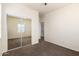 This bedroom features neutral carpet and walls, and sliding mirror door closet at 923 W Wendy Way, Gilbert, AZ 85233