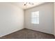 Carpeted bedroom with ceiling fan, a window, and neutral paint at 923 W Wendy Way, Gilbert, AZ 85233