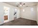 This bedroom features neutral carpet and walls, and two doorways at 923 W Wendy Way, Gilbert, AZ 85233